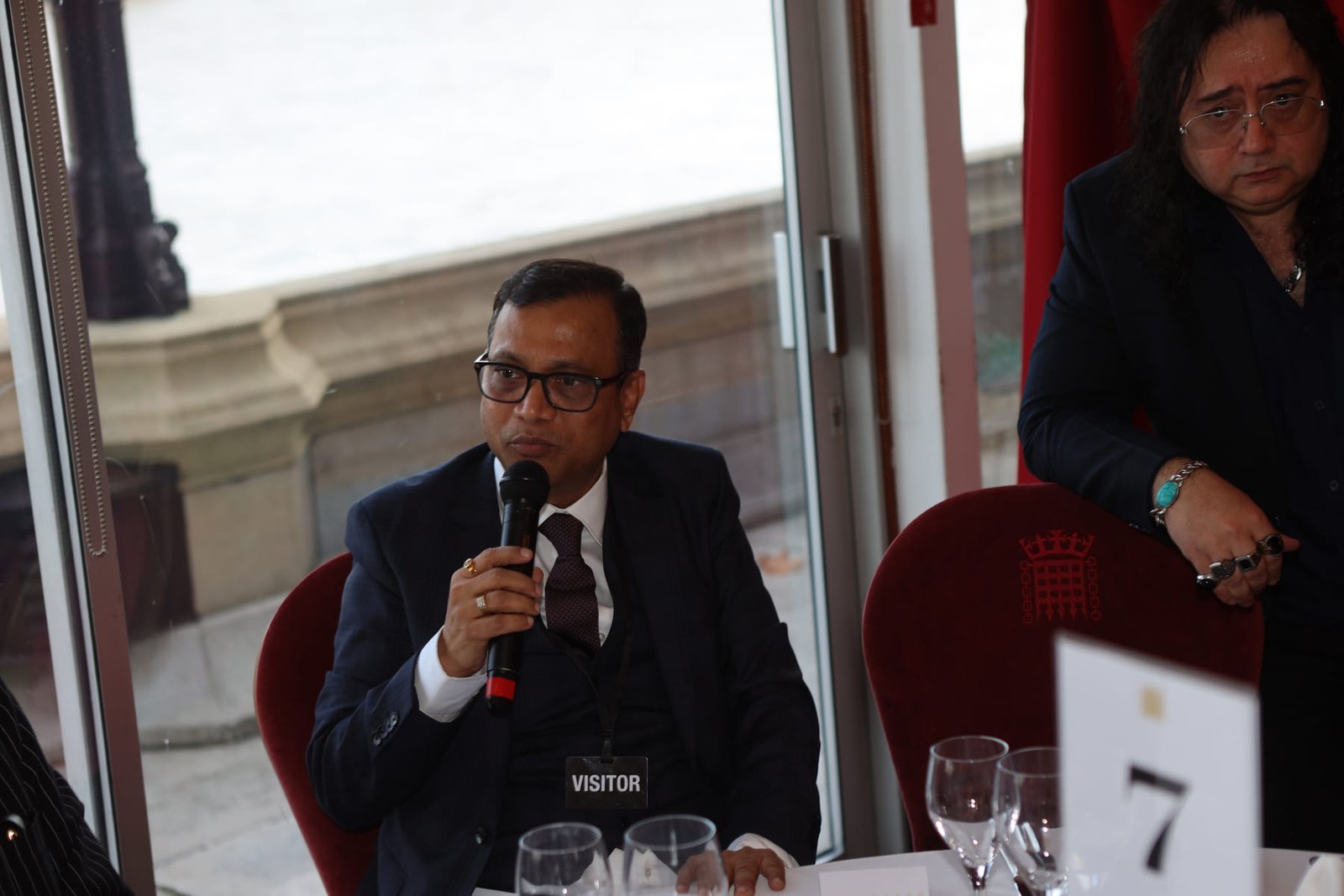A delegate addresses the table during the Westminster conclave