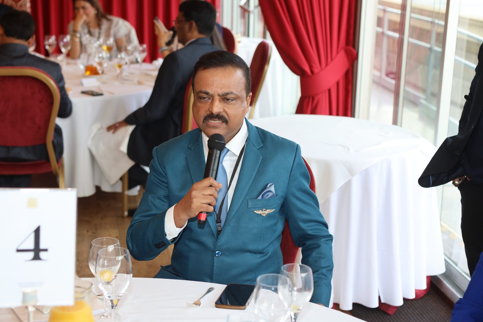 A delegate speaks during the round-table lunch at the Houses of Parliament