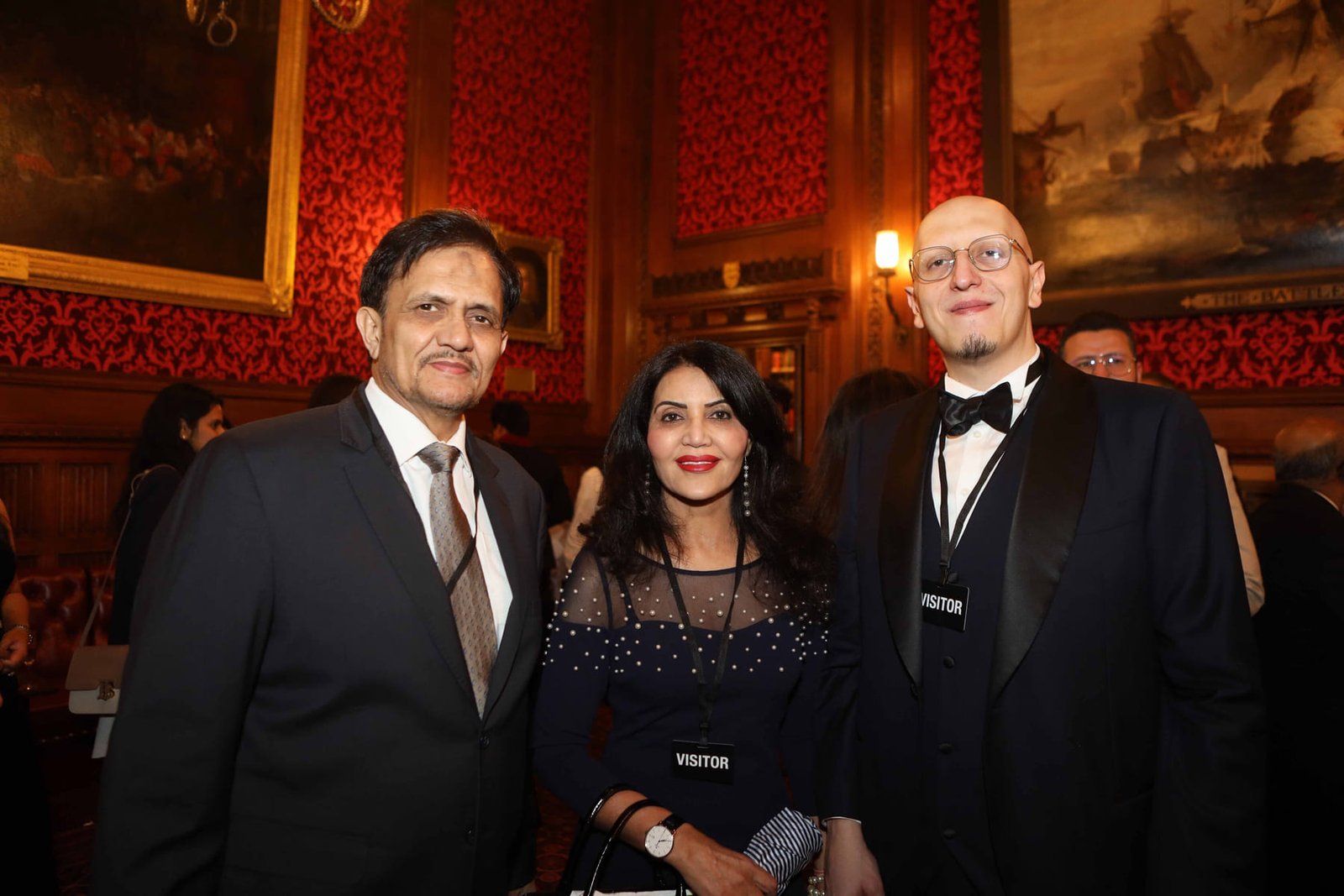 Three guests at the evening reception in the Cholmondeley Room
