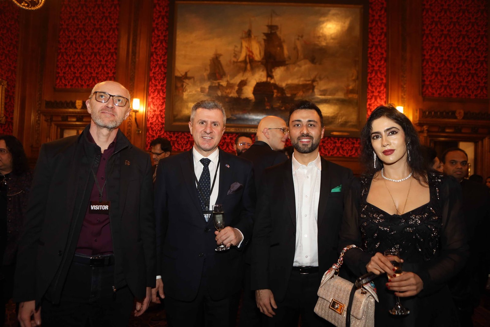 Four guests photographed together at the evening reception