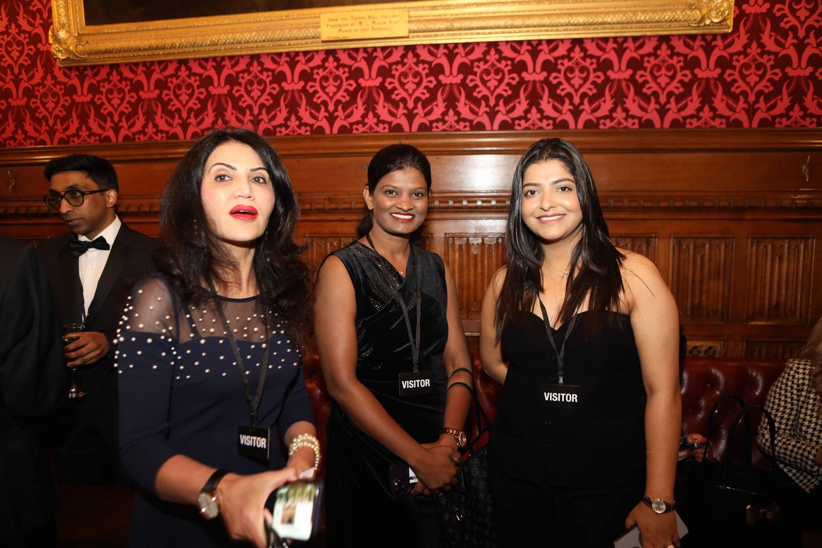 Three guests at the evening reception in the Cholmondeley Room
