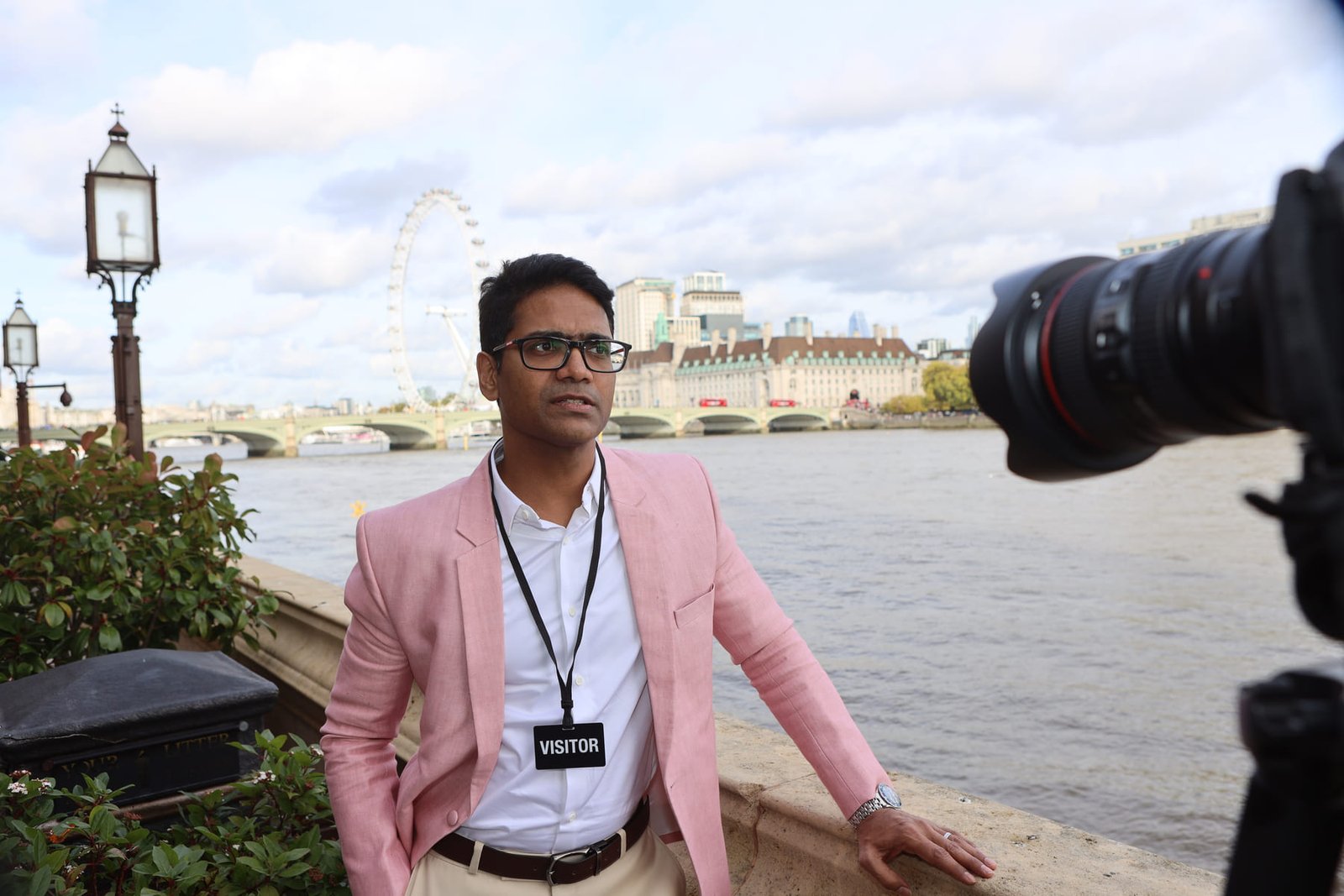 A leader interviewed beside the Thames at Westminster